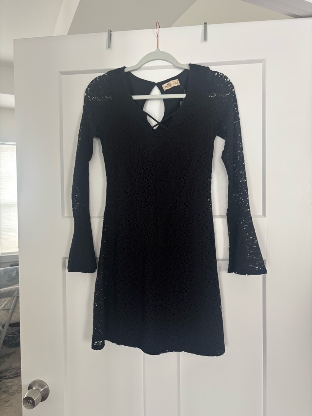 Black Lace Long Sleeve V-Neck Mini Dress with Crisscross neck and keyhole back.